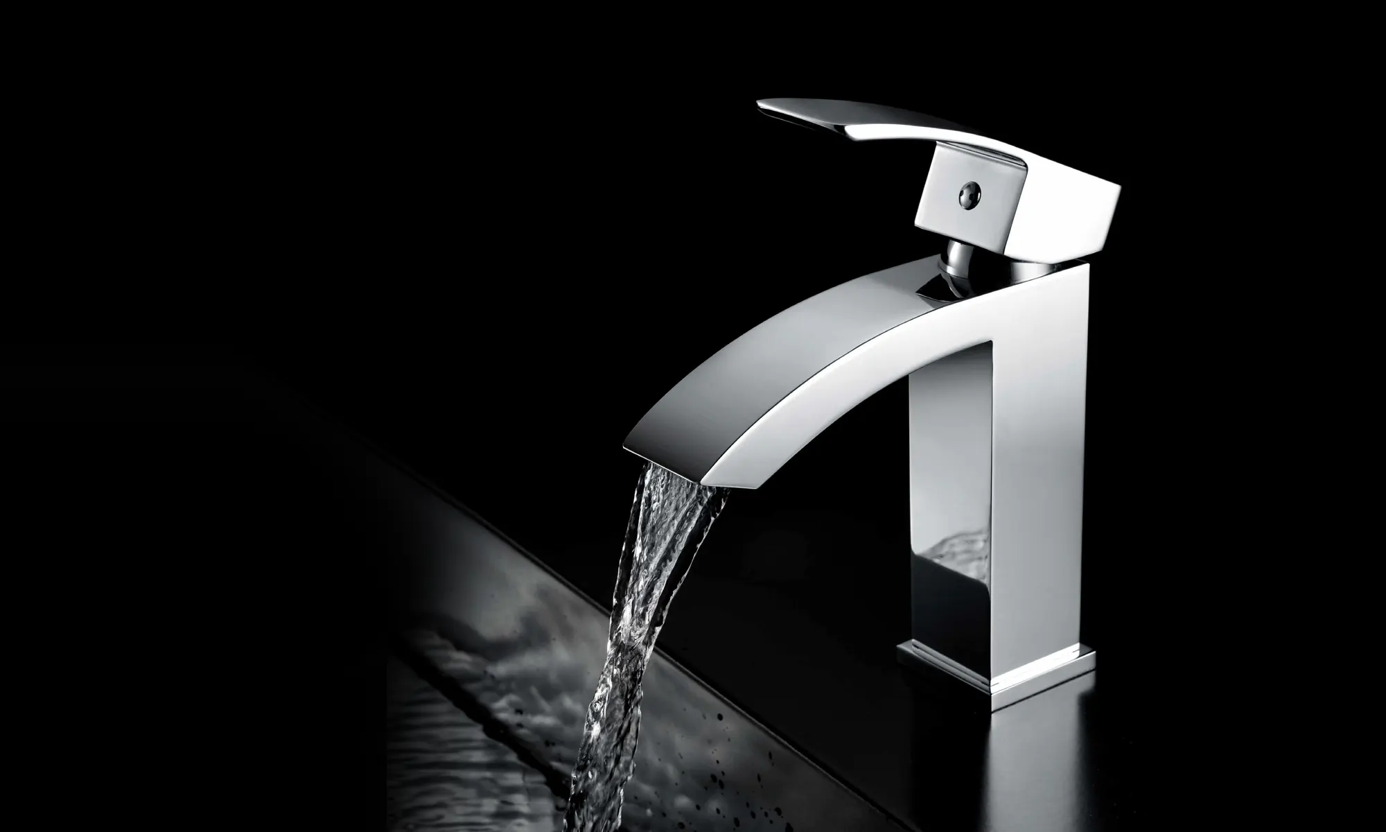 Chrome single-lever basin mixer with a curved waterfall spout, water running